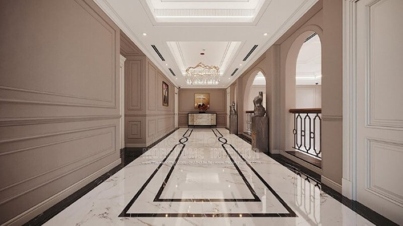 Trang trí hành lang đẹp ấn tượng từ sàn lát đá cao cấp, phào chỉ tường đẹp cùng đèn trang trí pha lê ấn tượng. Mẫu thiết kế và thi công nội thất biệt thự
