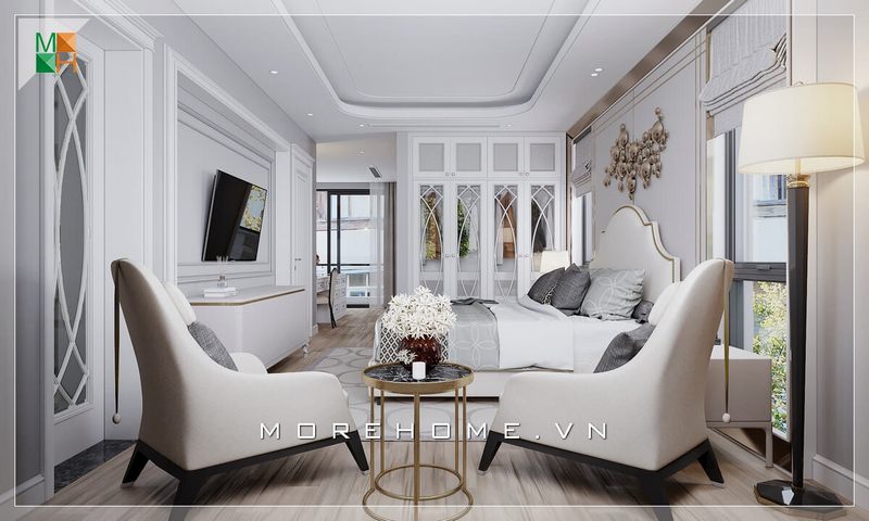 Không gian phòng ngủ được bố trí hợp lý với nội thất gỗ sơn trắng nhẹ nhàng, ghế đôi cạnh giường để gia chủ thư giãn trước khi nghỉ ngơi.